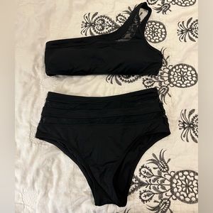 Black womens swim suit. Sheer stripes